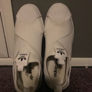 Pre-owned Adidas white slip ons.